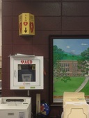 AED mounted on wall in Swain Middle School office area